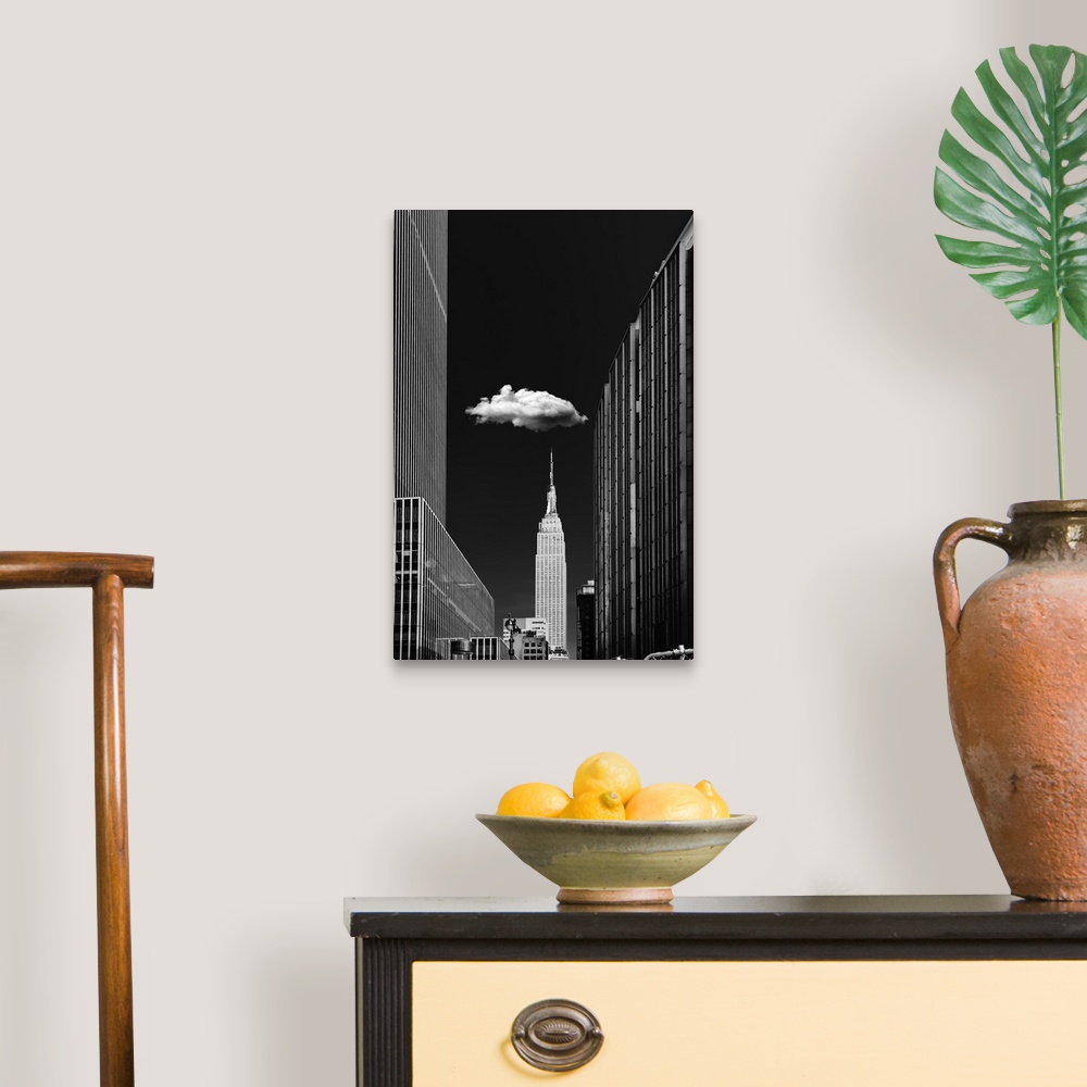 A traditional room featuring Black and white photograph of a New York City cityscape highlighting the single cloud hanging ove...