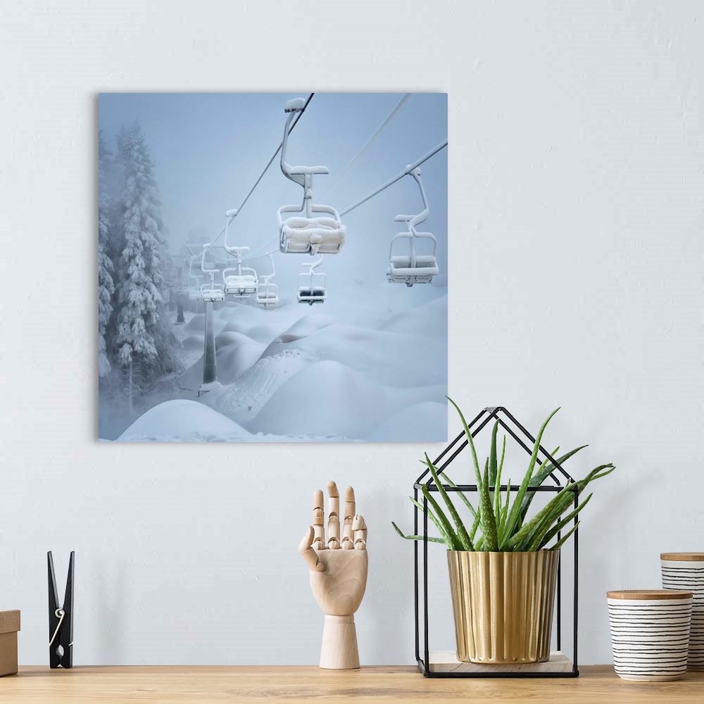 A bohemian room featuring A ski lift and surrounding landscape covered in snow.