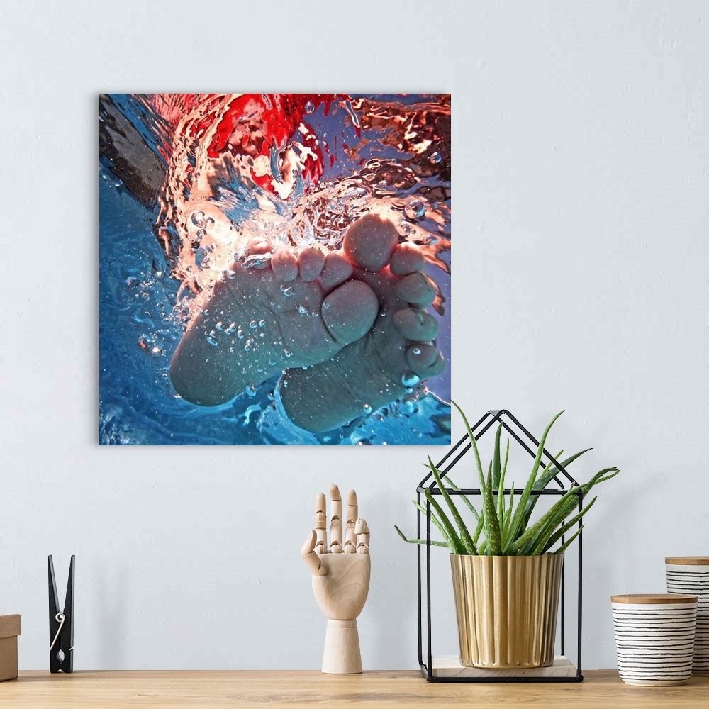 A bohemian room featuring Underwater photograph of a feet splashing around.