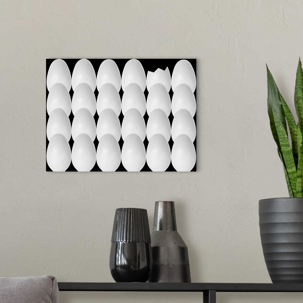 A modern room featuring Abstract image of plastic spoons arranged to resemble a group of eggs with one cracked.