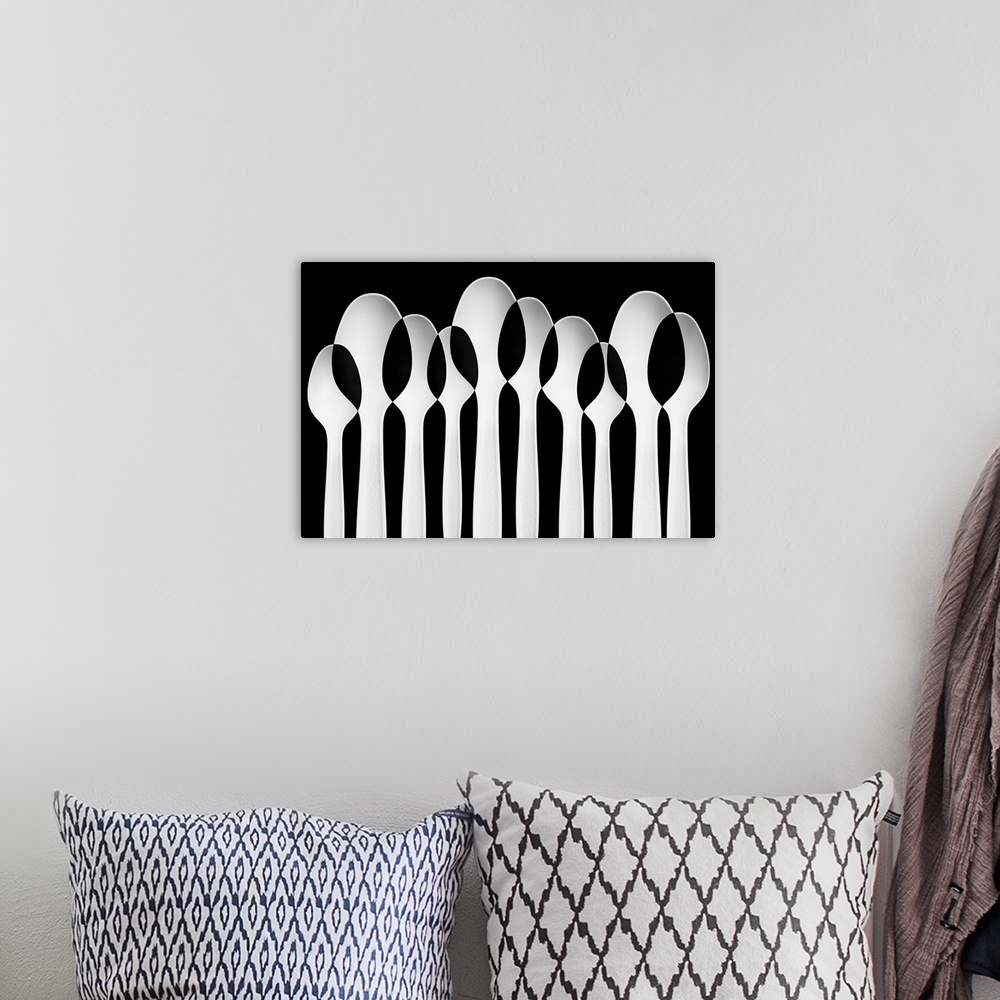 A bohemian room featuring Spoons standing in a row, with negative space where they intersect.