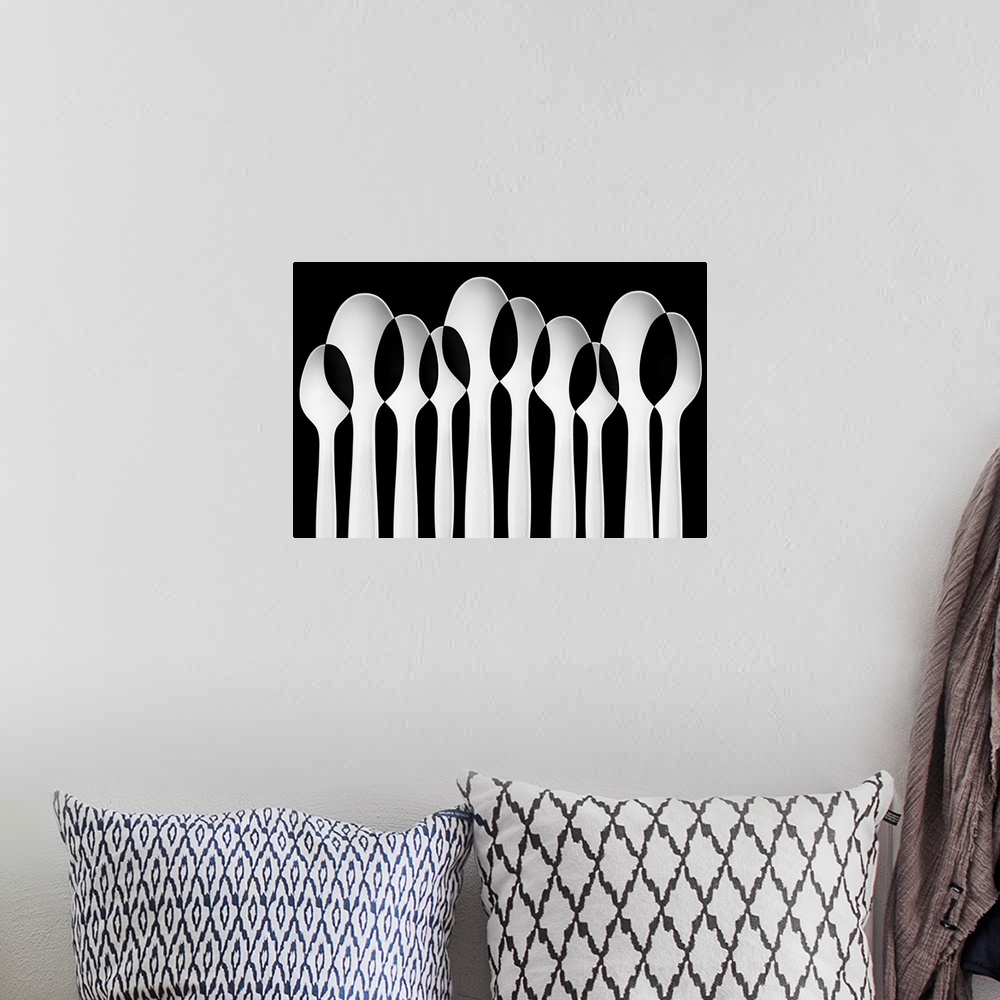 A bohemian room featuring Spoons standing in a row, with negative space where they intersect.