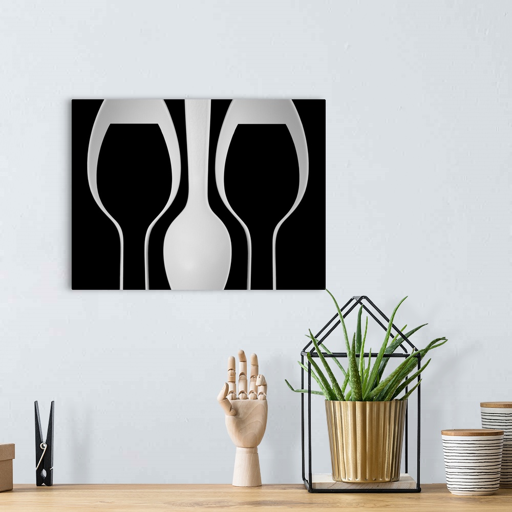 A bohemian room featuring Abstract image of plastic spoons arranged to resemble wine glasses.