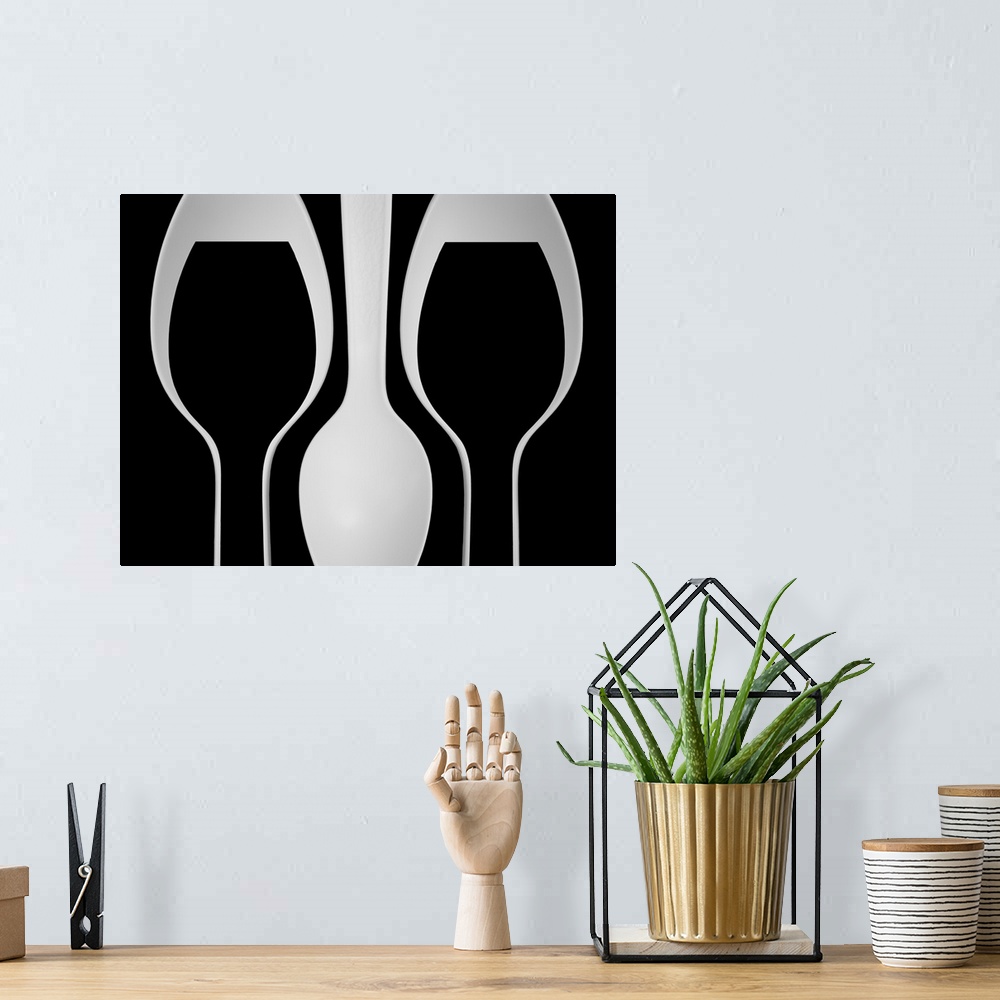 A bohemian room featuring Abstract image of plastic spoons arranged to resemble wine glasses.