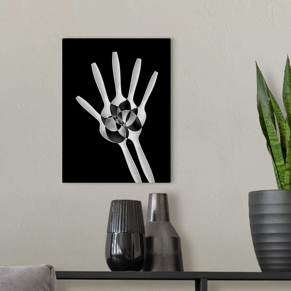 A modern room featuring Abstract image of plastic spoons arranged to resemble the bones of a hand.