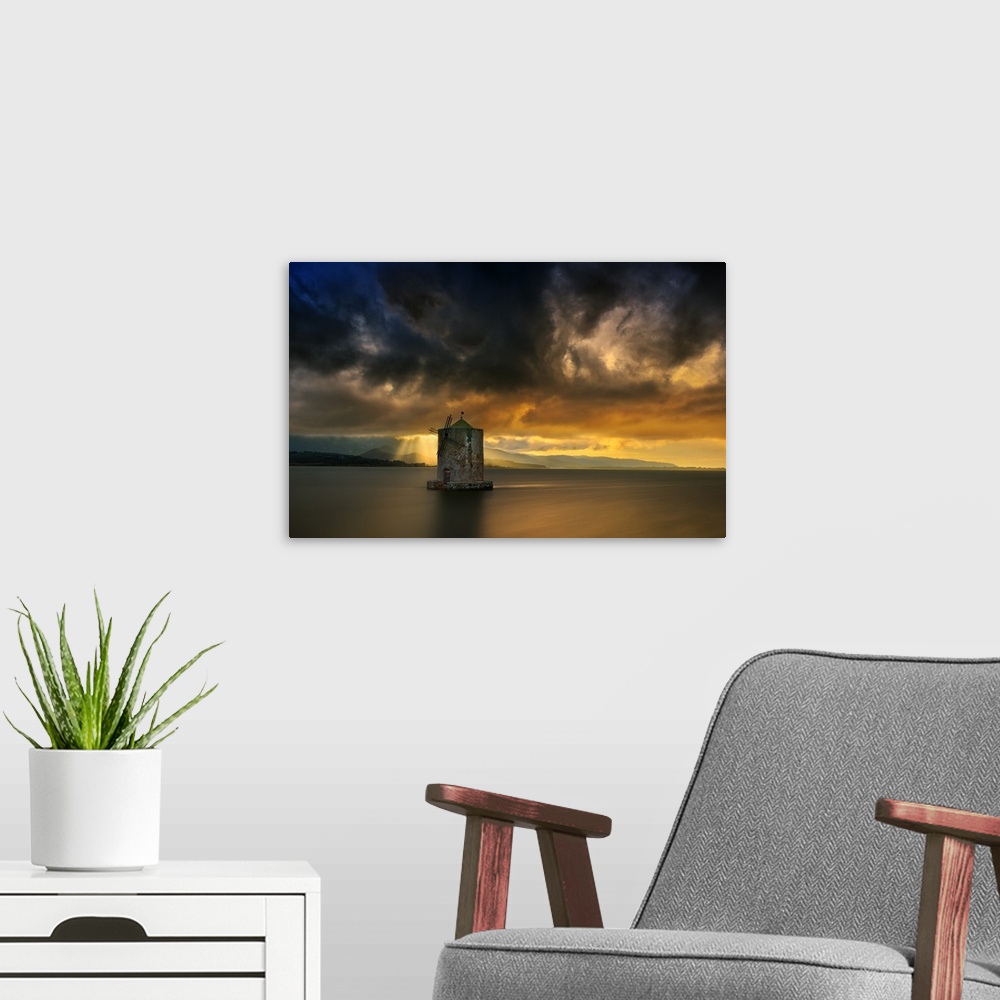 A modern room featuring Landscape photograph of calm water and a dramatic sky in Italy.