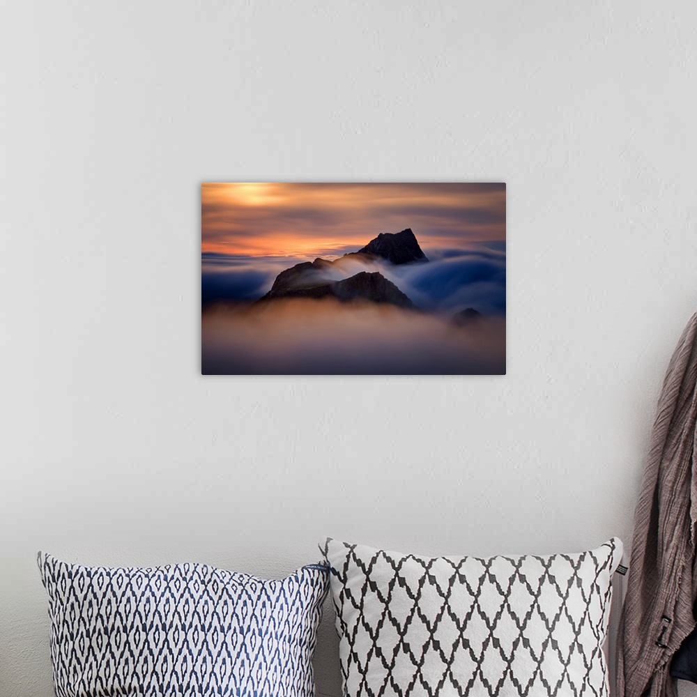 A bohemian room featuring Colorful sunset in foggy mountains of Moskenesoya, Lofoten