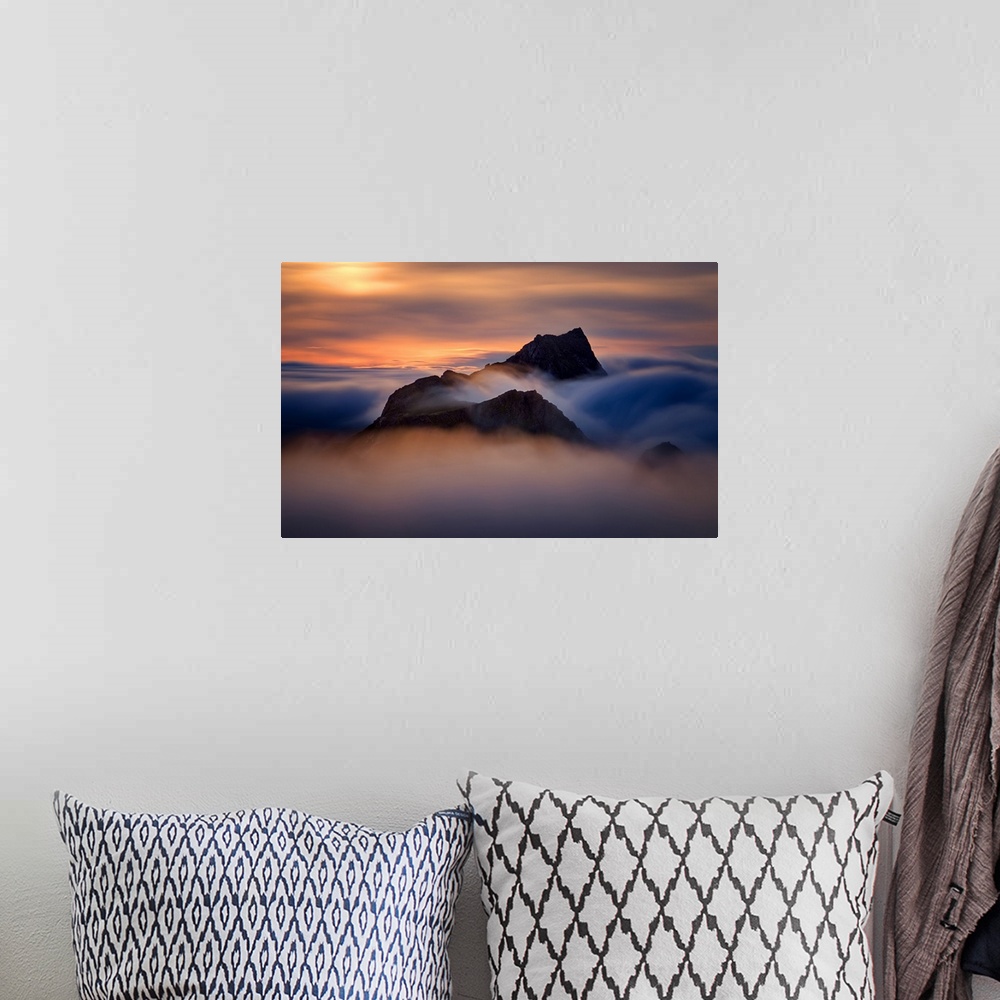 A bohemian room featuring Colorful sunset in foggy mountains of Moskenesoya, Lofoten