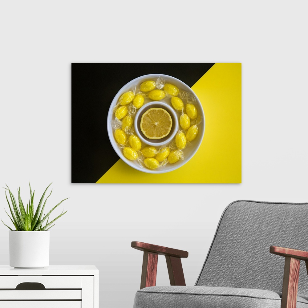 A modern room featuring A bowl of lemon candies and a lemon slice.