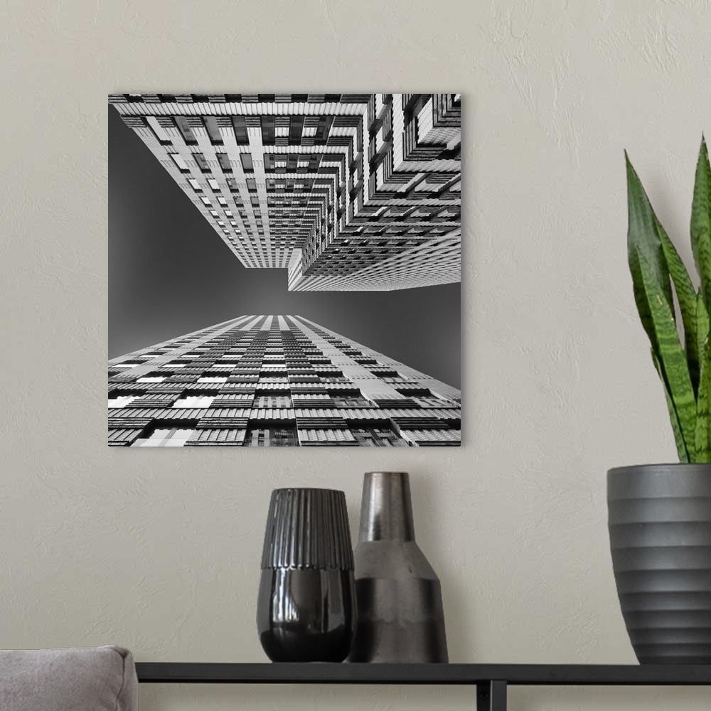 A modern room featuring Black and white image of skyscrapers seen from the ground, creating an abstract image.
