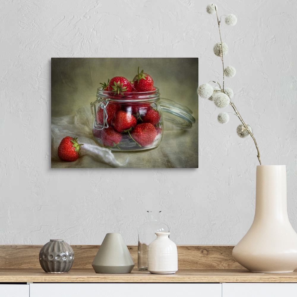 A farmhouse room featuring A jar full of bright red strawberries.