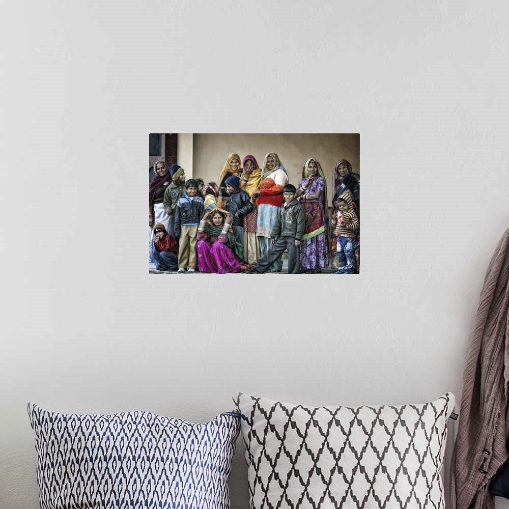 A bohemian room featuring A group of Indian people wearing colorful robes.