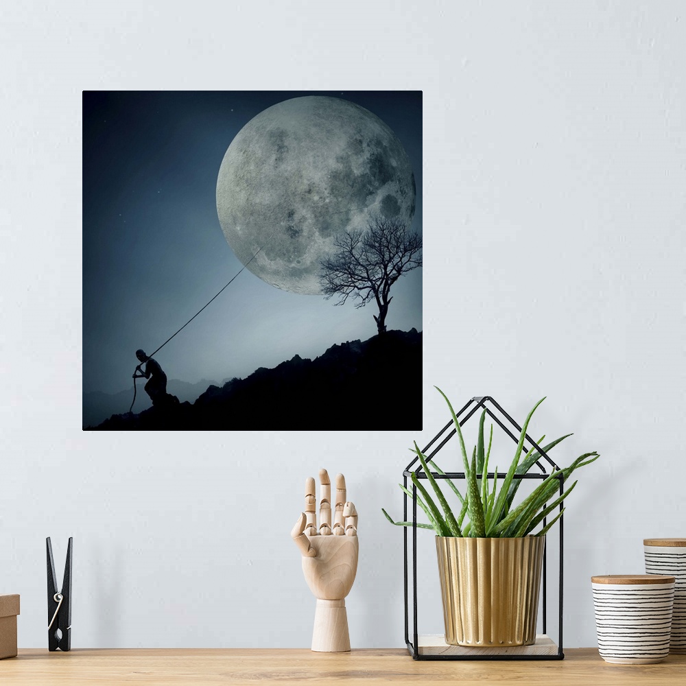 A bohemian room featuring Conceptual image of a man pulling the moon behind him with a rope, down a hill.