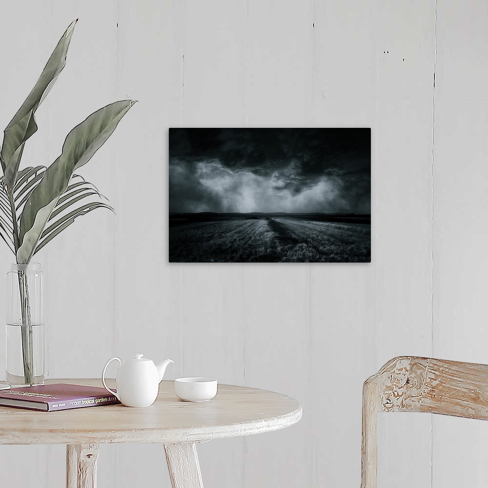 A farmhouse room featuring An ethereal field in the countryside under a blanket of menacing clouds.