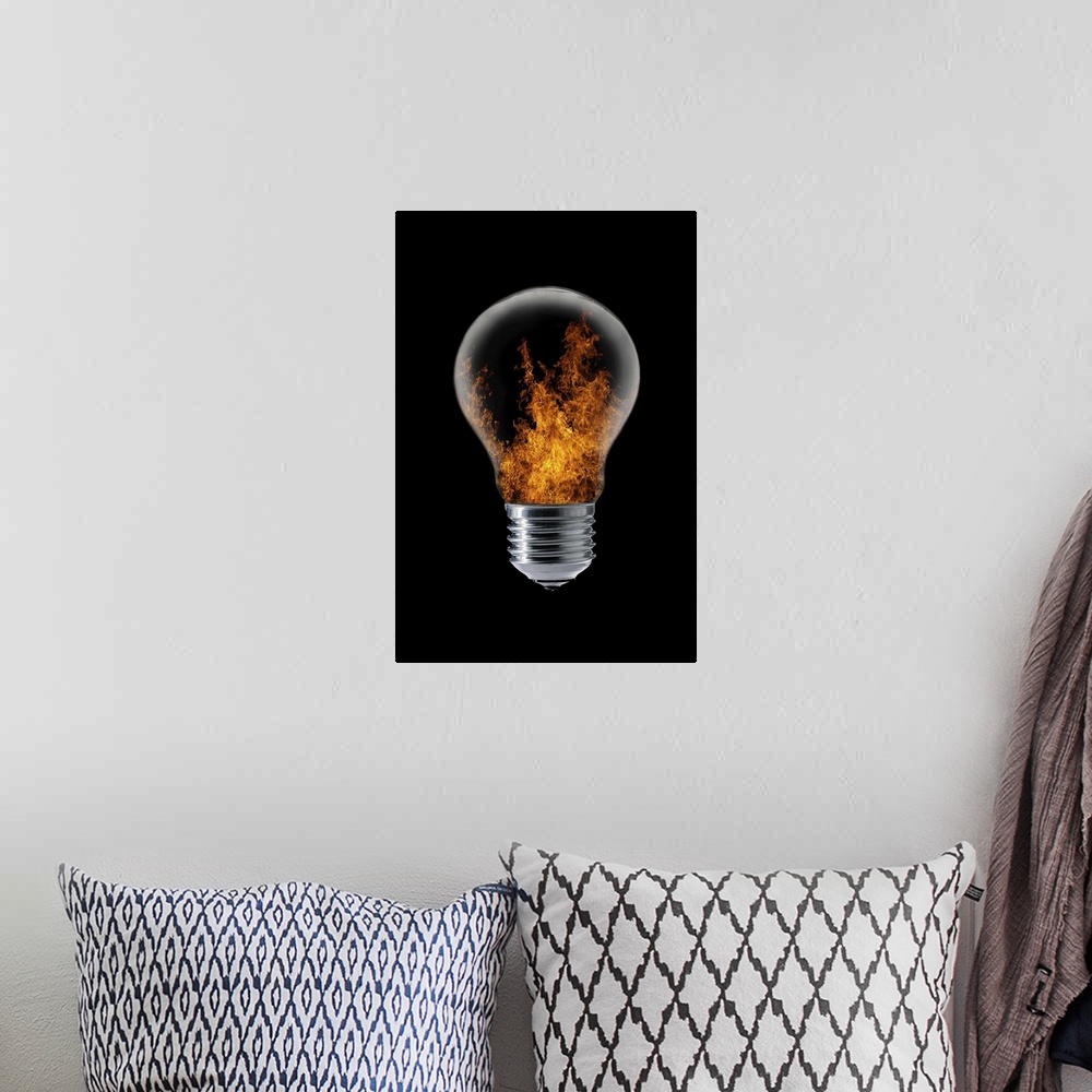 A bohemian room featuring Conceptual image of a lightbulb with flames inside.