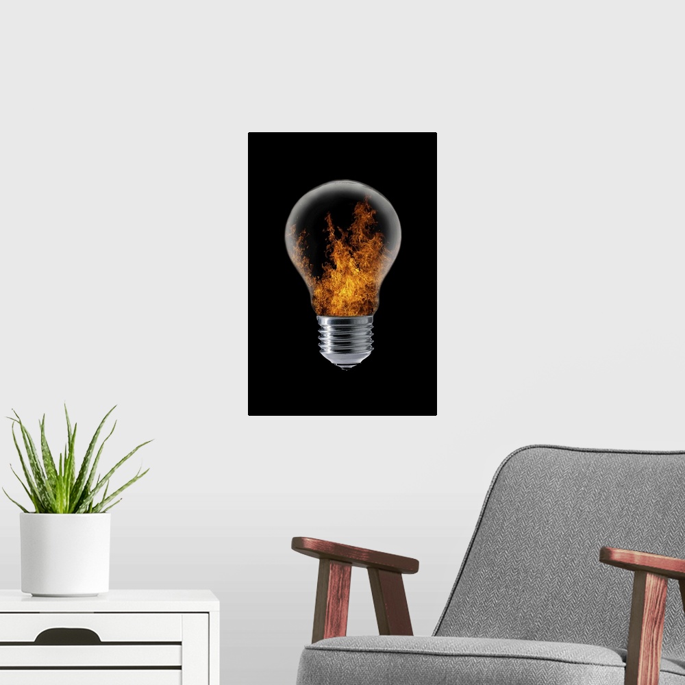 A modern room featuring Conceptual image of a lightbulb with flames inside.
