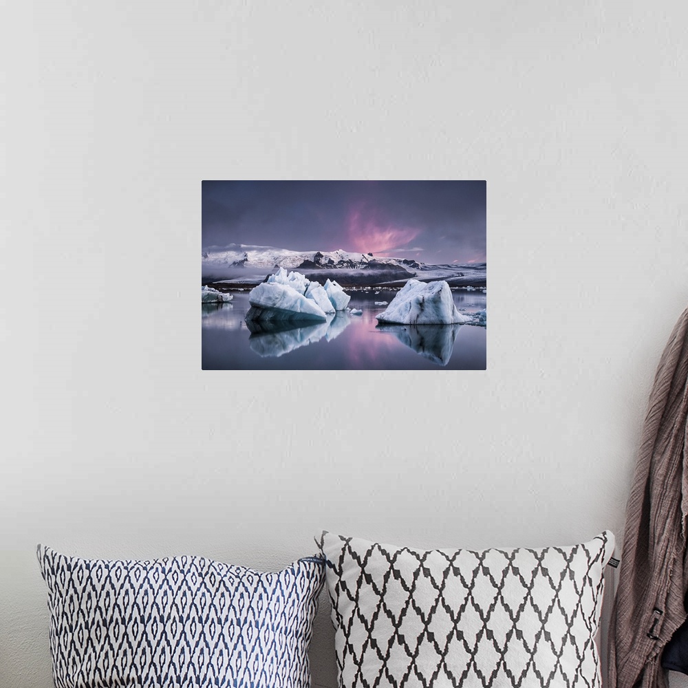 A bohemian room featuring Large glaciers in the water with snowy mountains in the distance under a pastel-colored sky, Joku...