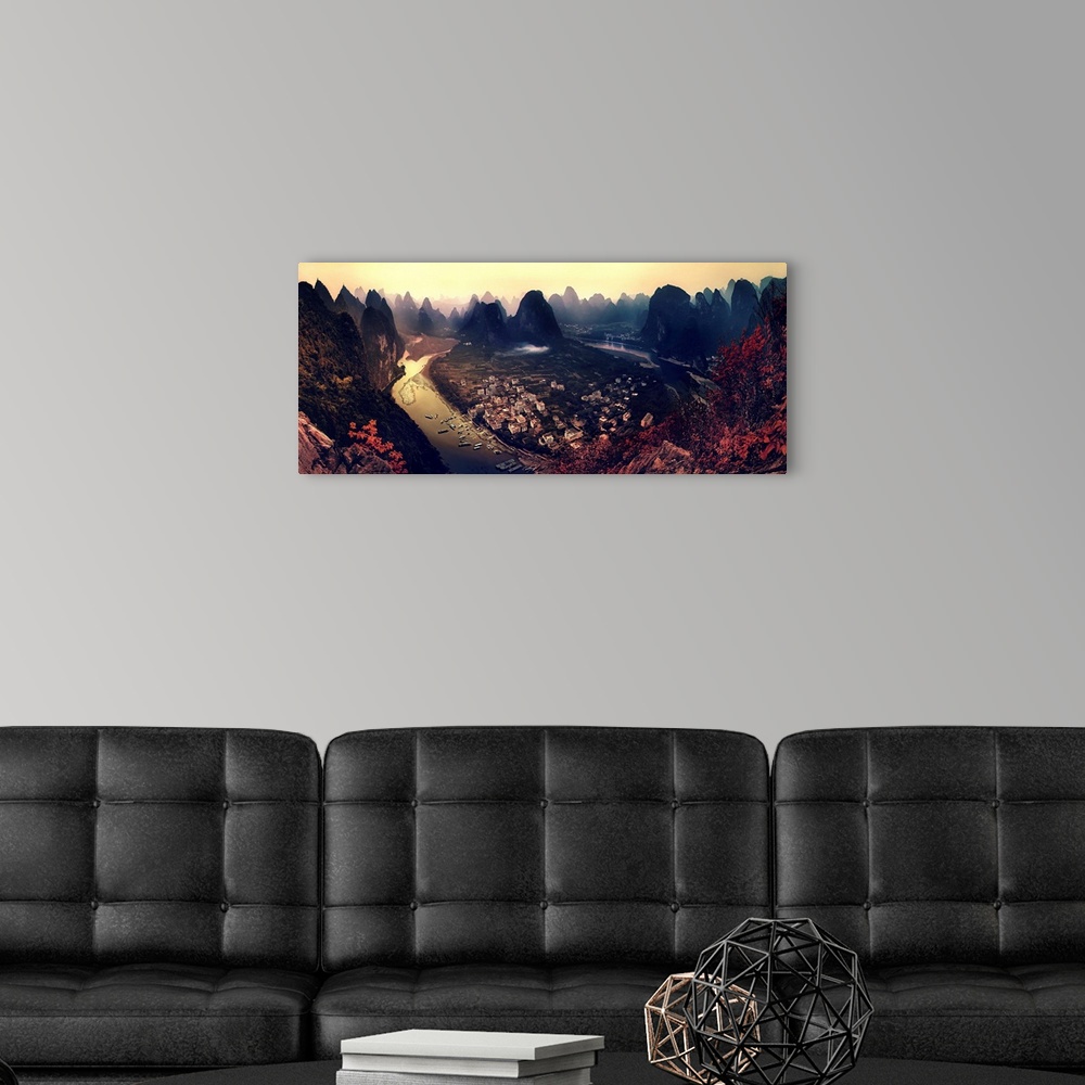 A modern room featuring A dynamic and intense photograph of a view of the Karst mountains in Guangxi, China.
