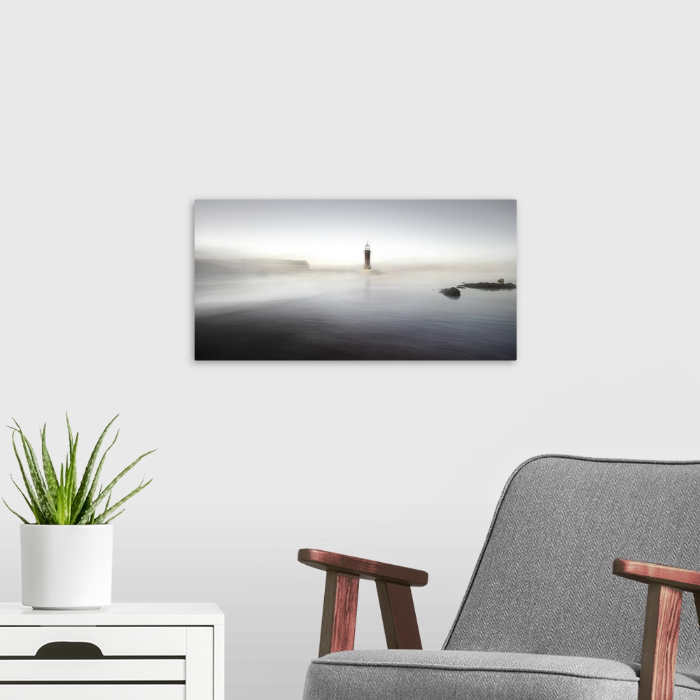 A modern room featuring A lighthouse on a pier partially obscured by mist, making it appear as though it is rising from t...