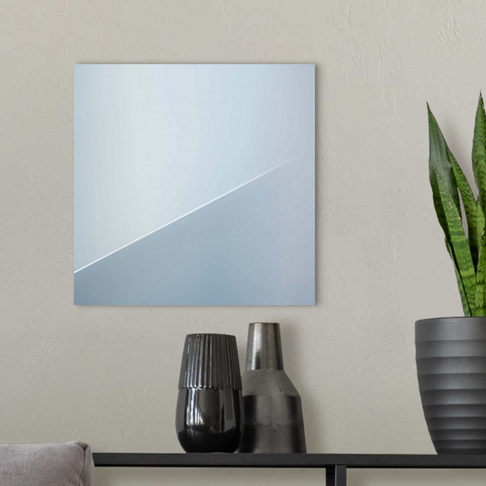 A modern room featuring Abstract image of architectural details, resembling a diagonal line.