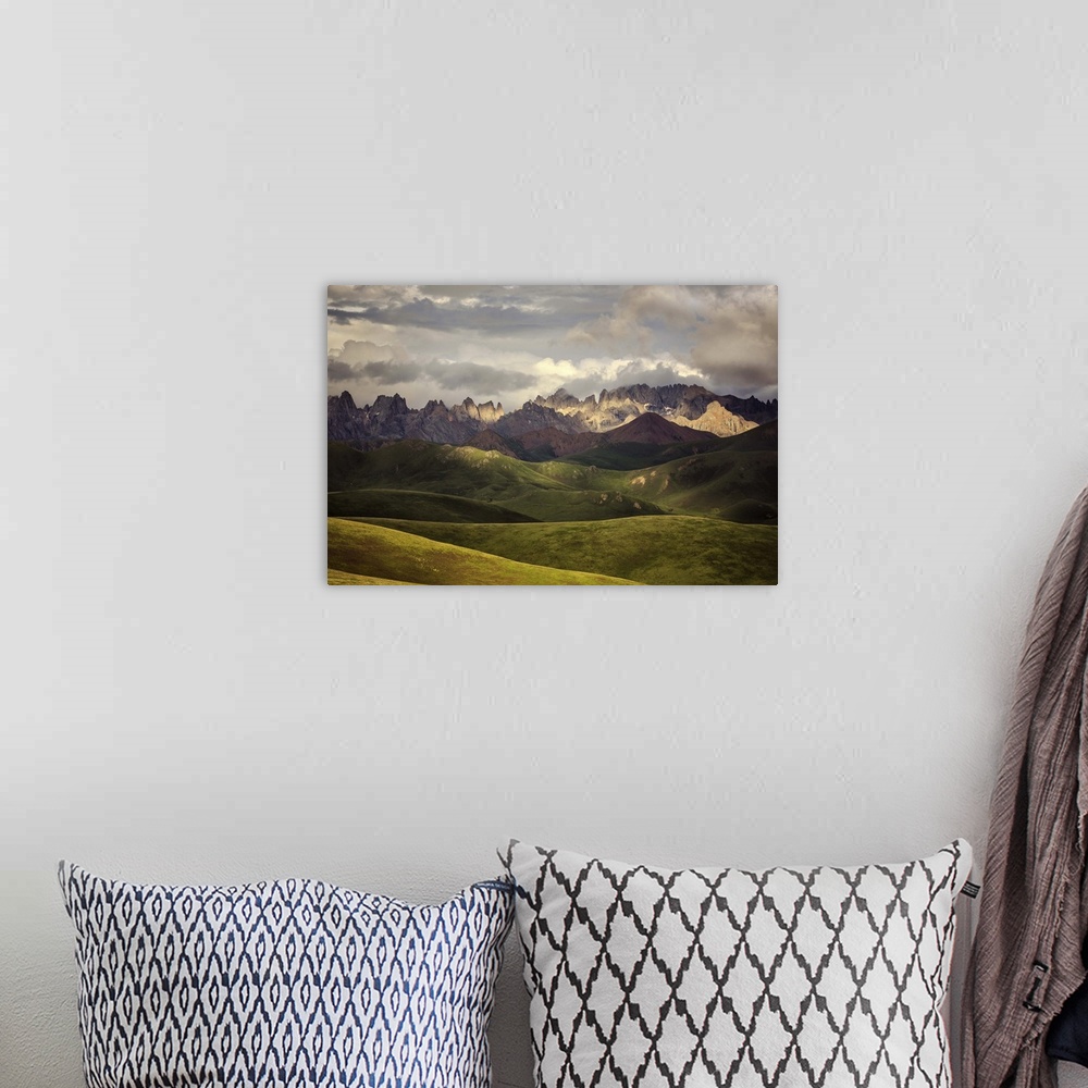 A bohemian room featuring Rolling green hills of and mountainous Tibetan valley, China.