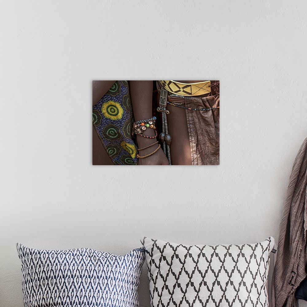 A bohemian room featuring Photograph of the jewelry worn by tribes people.