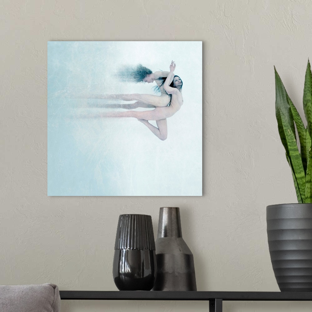 A modern room featuring A conceptual photograph of nude male and female back to back against a white background.