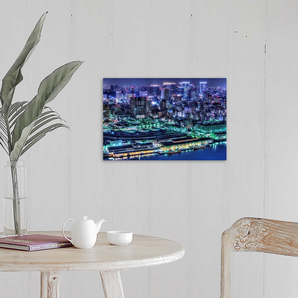 A farmhouse room featuring A photograph of the cityscape of Tokyo at night lit up in neon lights, Japan.