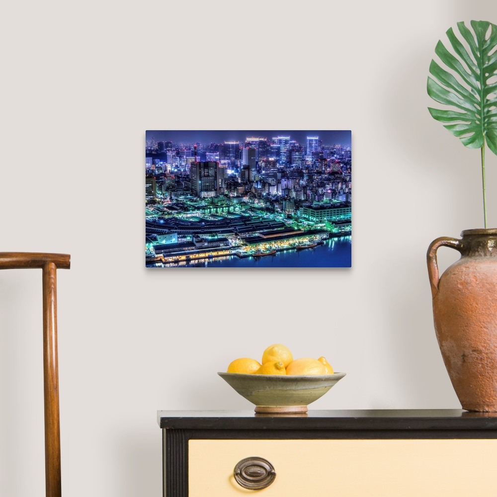 A traditional room featuring A photograph of the cityscape of Tokyo at night lit up in neon lights, Japan.