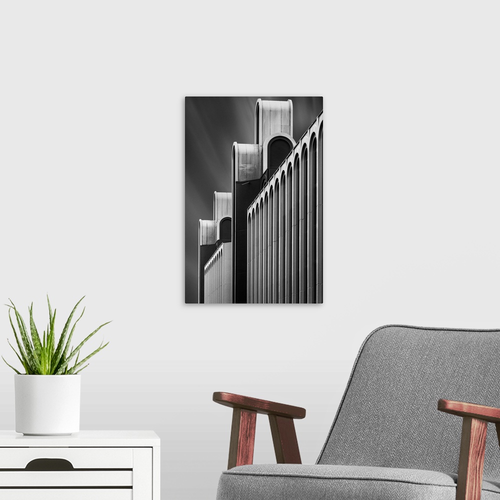 A modern room featuring Black and white image of the facade of a a structure, creating an abstract image.