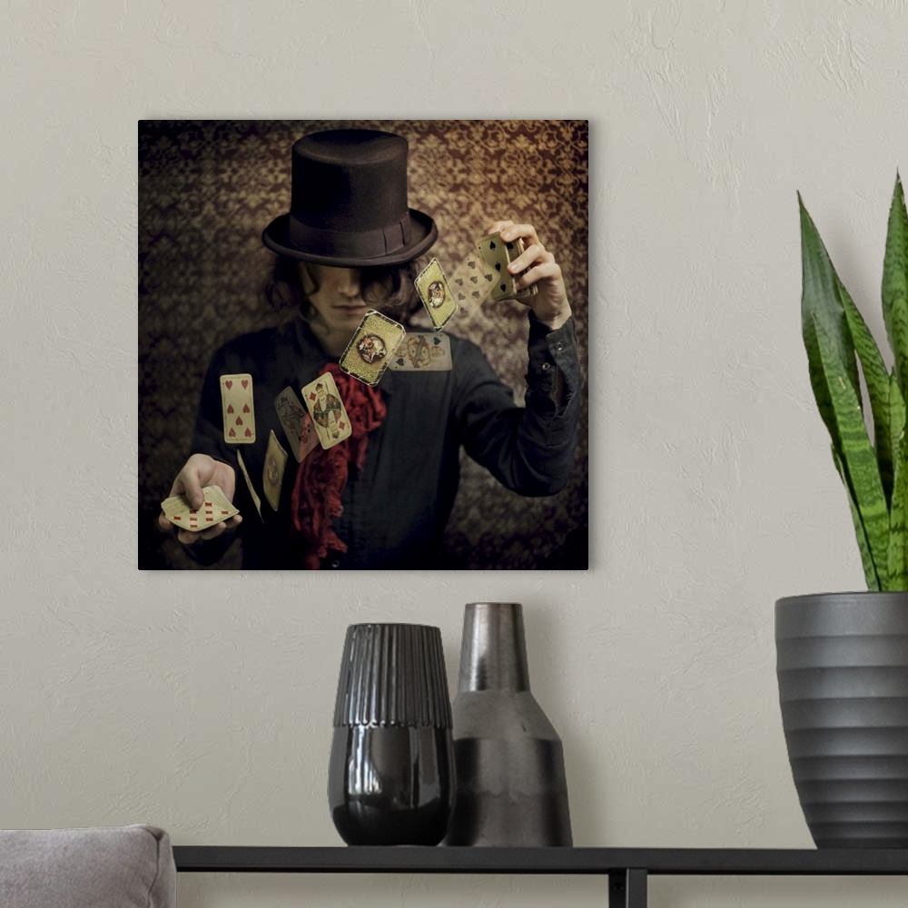 A modern room featuring Conceptual image of a magician flipping playing cards in the air.