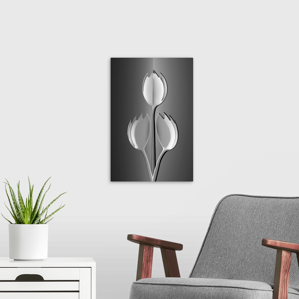 A modern room featuring Three sporks arranged to resemble three tulips.