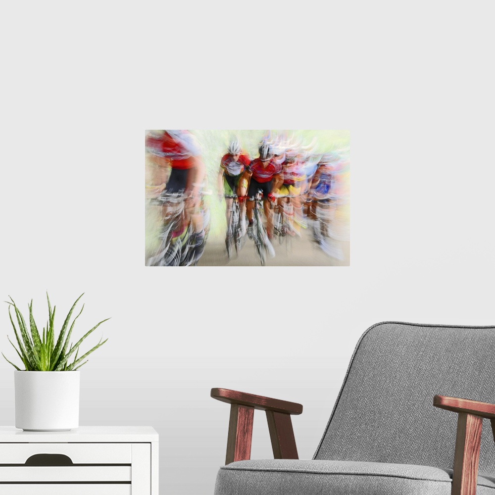 A modern room featuring Action photograph of a cyclists in a blur of fast motion.