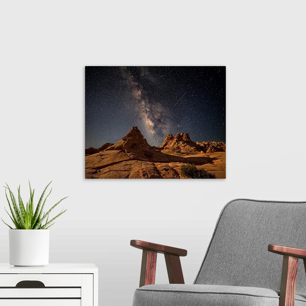 A modern room featuring Rock formations in the desert of Coyote Buttes, Arizona, under a starry night sky.