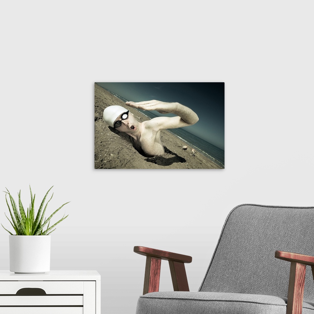 A modern room featuring A swimmer with a cap and goggles attempting to swim in the sand.