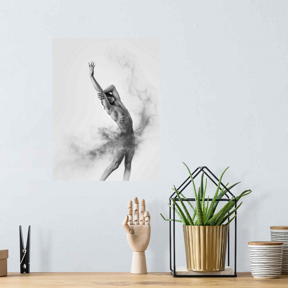 A bohemian room featuring Black and white fine art photograph of a male model posing gracefully and gray smoke moving aroun...