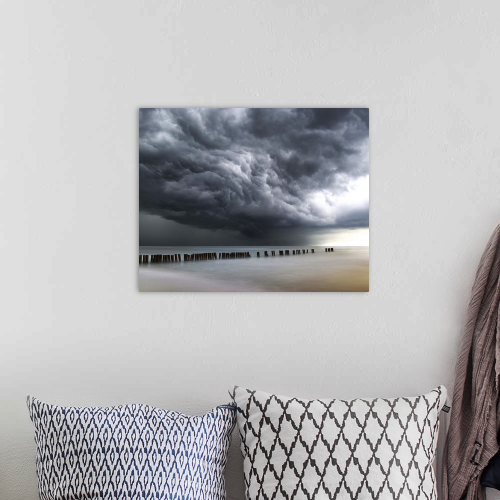 A bohemian room featuring Photograph of dark, dramatic clouds rolling in over the ocean before a thunderstorm.