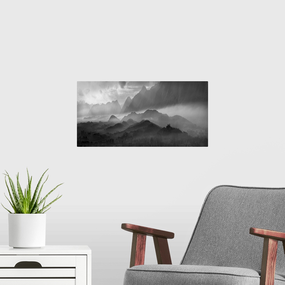 A modern room featuring Black and white image of a misty mountain landscape.