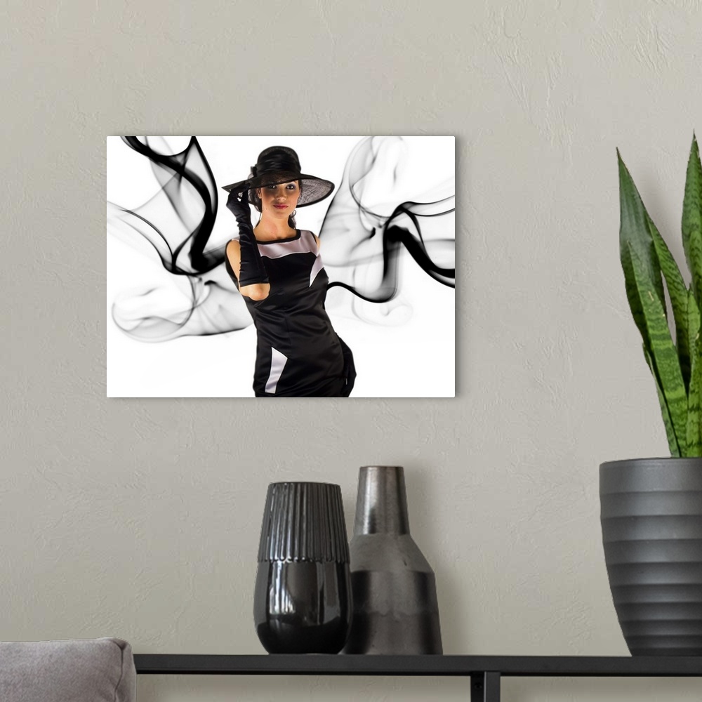 A modern room featuring Portrait of a woman dressed in black with dark smoke around her.