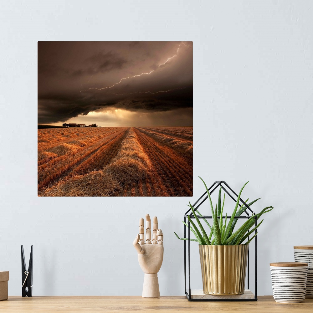 A bohemian room featuring A countryside farmland under a cloudy lightning filled sky.