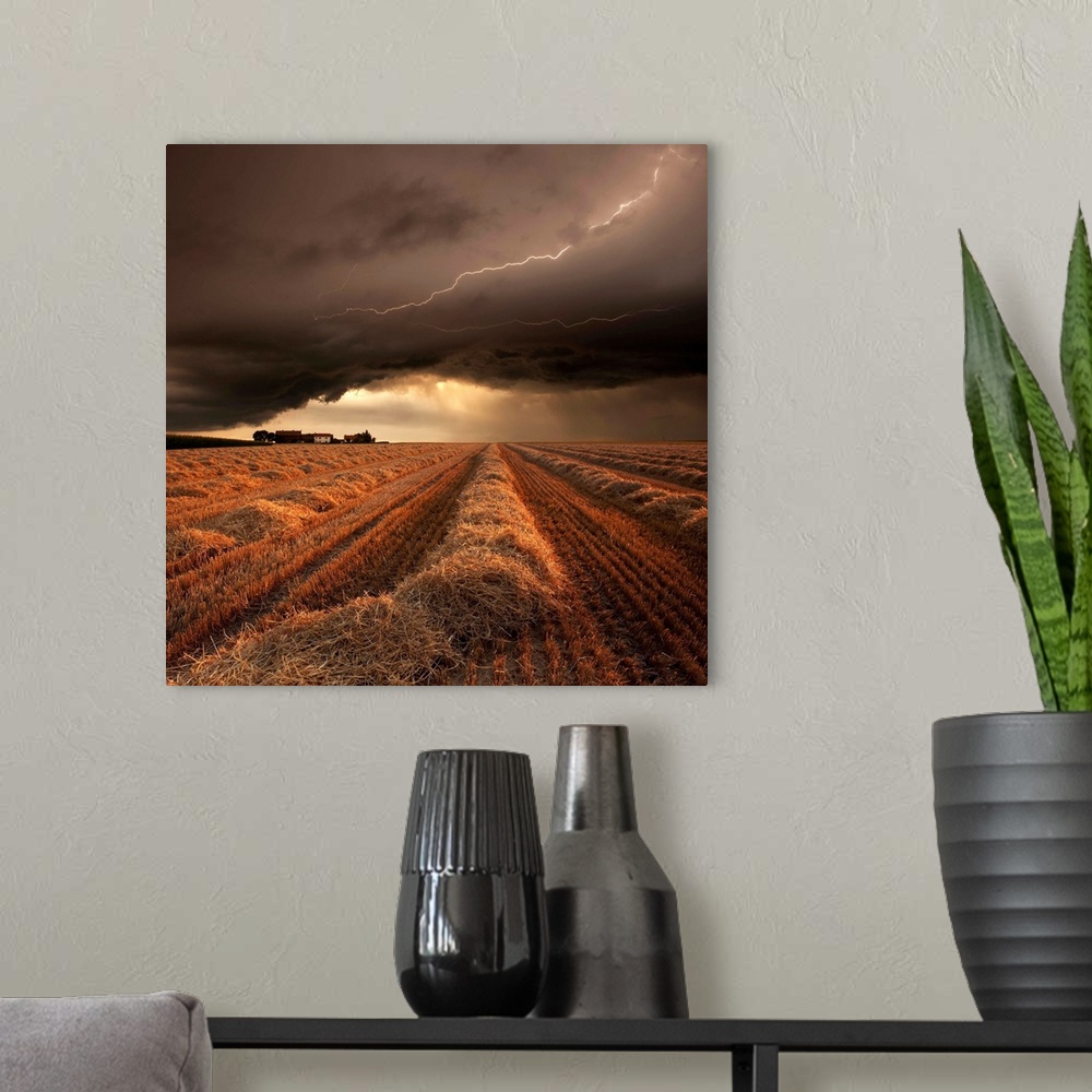 A modern room featuring A countryside farmland under a cloudy lightning filled sky.