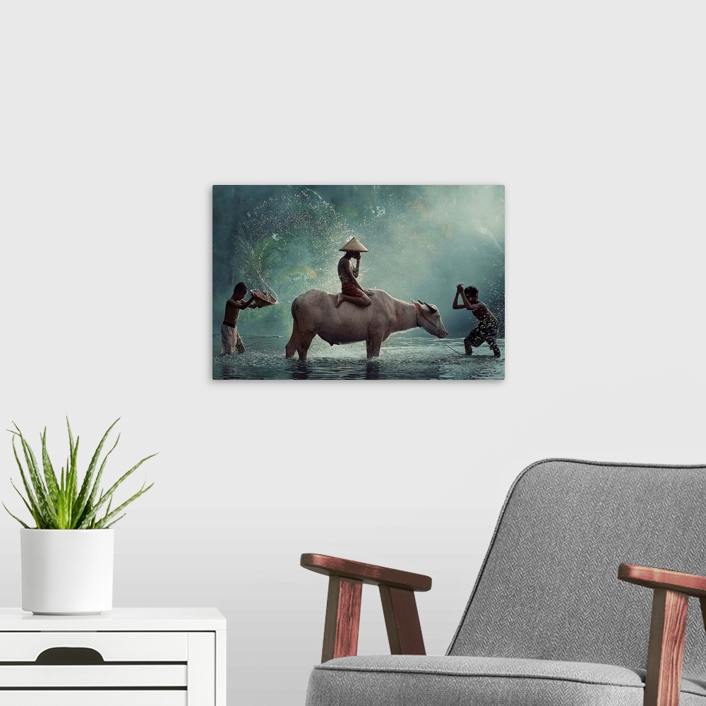A modern room featuring A boy sitting on a cow while other people splash water on them.