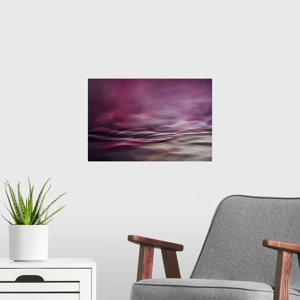 A modern room featuring Abstract digital art with pink and gray hues and curvy lines creating movement.