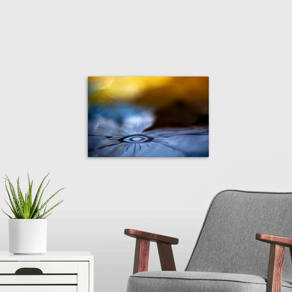 A modern room featuring Abstract digital art resembling a flower in water.