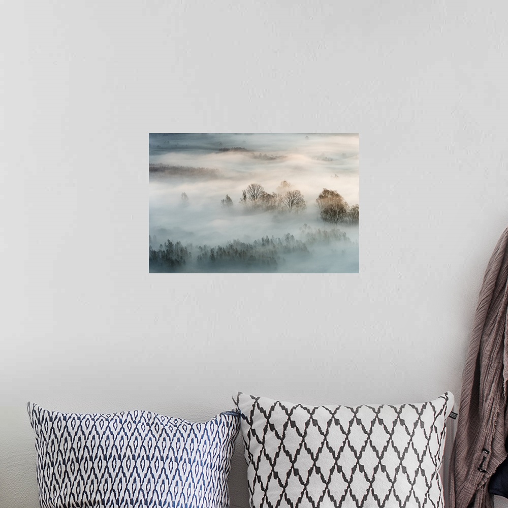 A bohemian room featuring Landscape photograph of the sunrise with heavy fog during Winter in Italy.