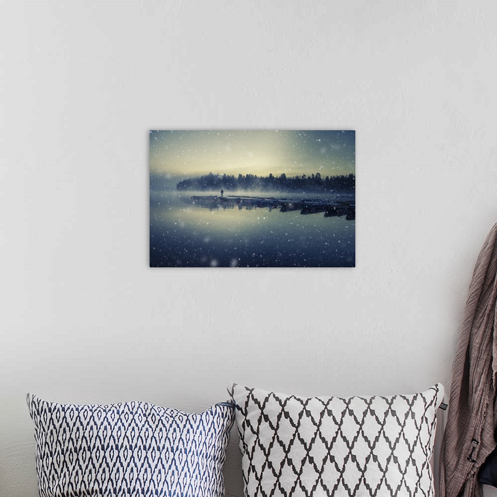 A bohemian room featuring Landscape photograph of a row of docked boats during a snow storm in Finland.