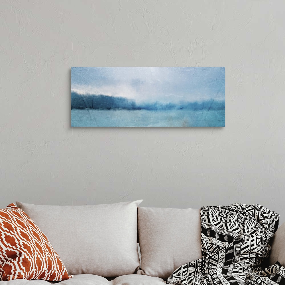 A bohemian room featuring Abstract landscape painting of a deep blue lake with forests along the edge.