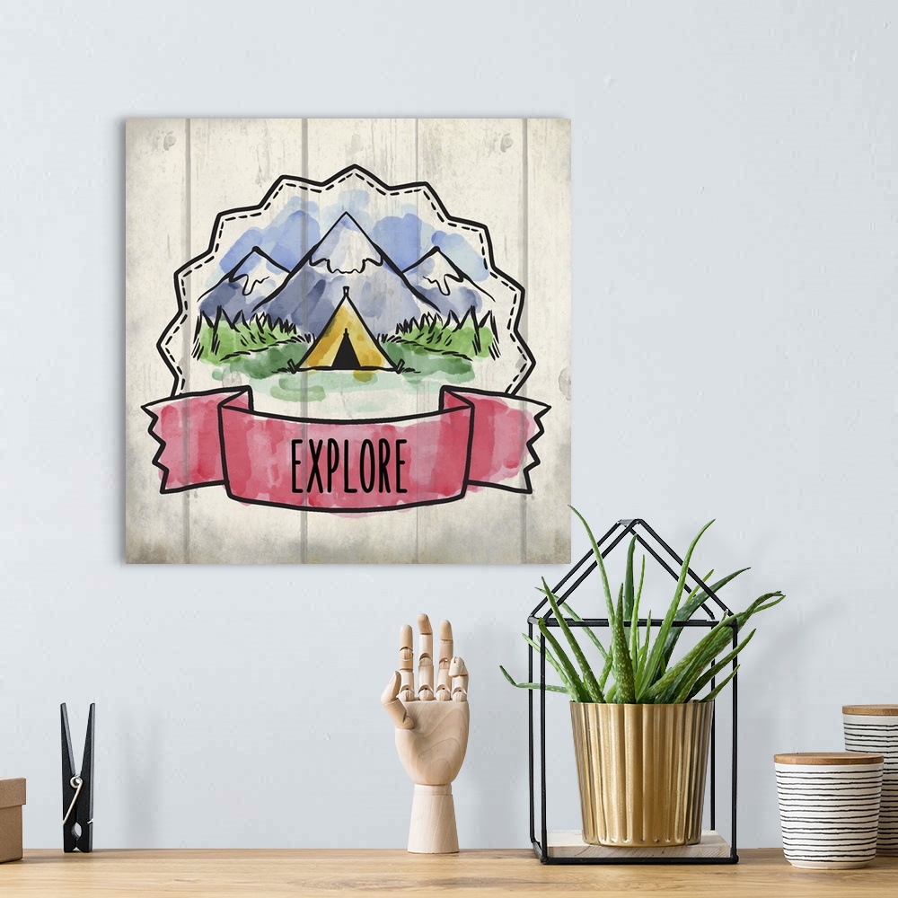 A bohemian room featuring Wanderlust themed design with a banner reading "Explore" and a tent in front of mountains.