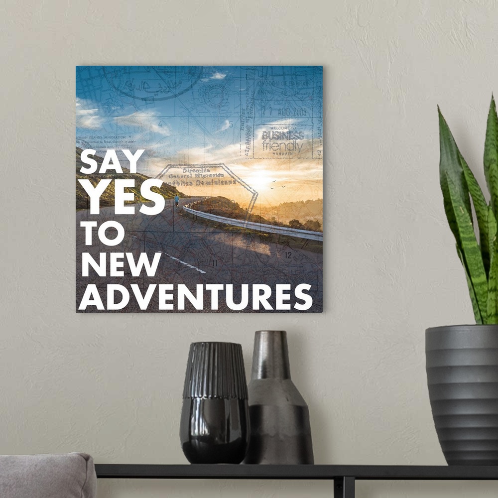 A modern room featuring "Say Yes to New Adventures" written on a photograph of a winding mountain road with the sun risin...