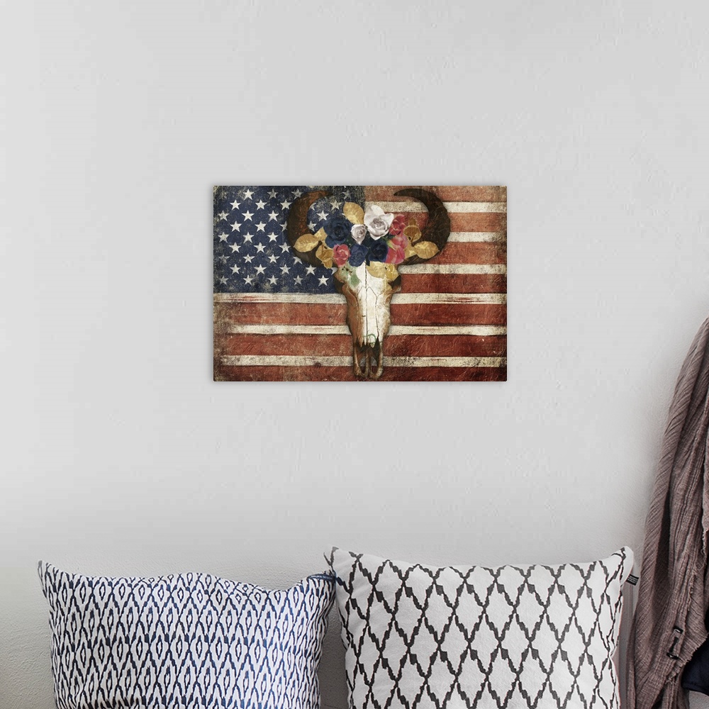 A bohemian room featuring A rustic American flag with a bull skull wearing a crown of flowers on top.
